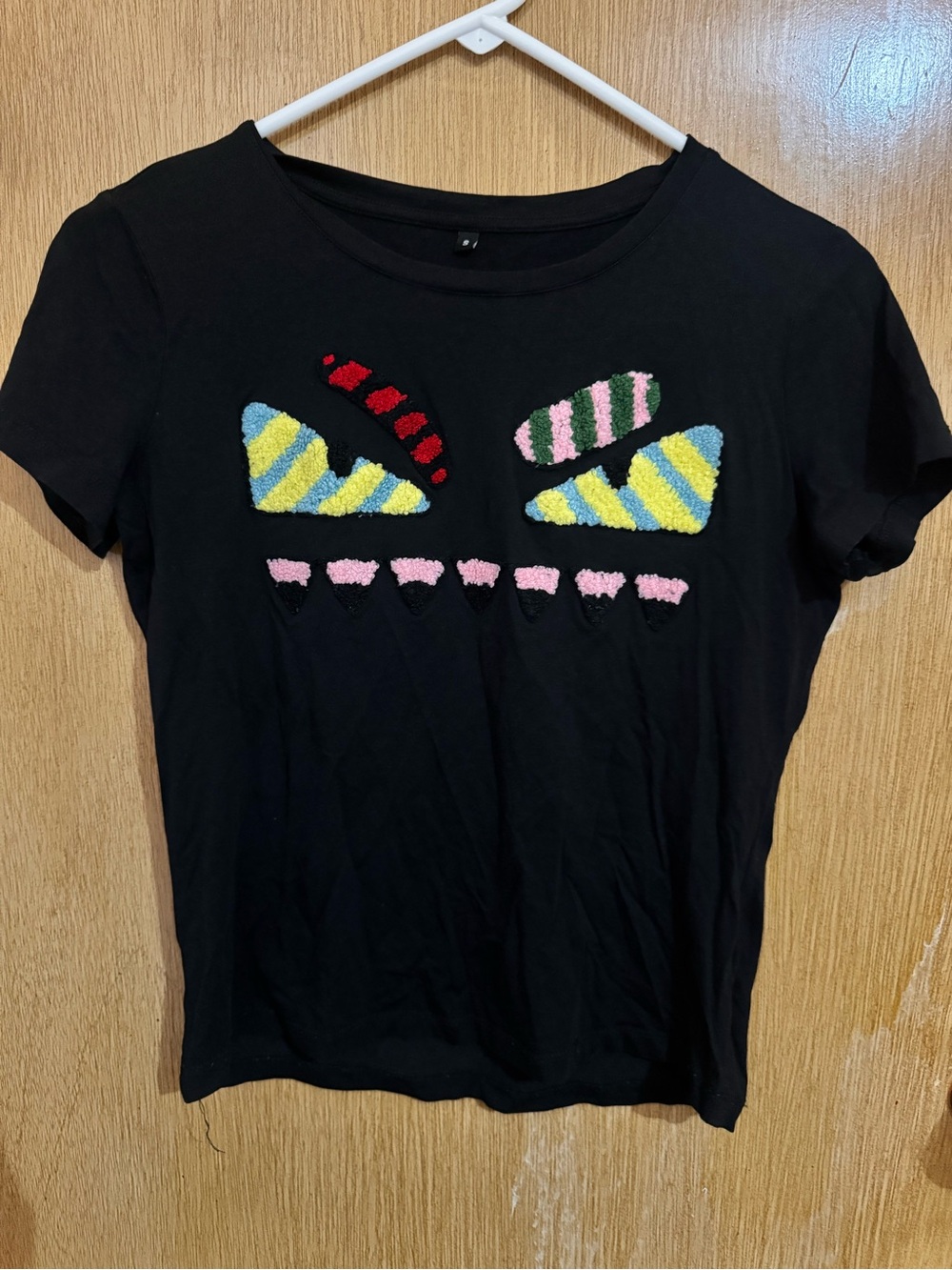 Black Short-Sleeve Tee with Colorful Chenille Patch Motif